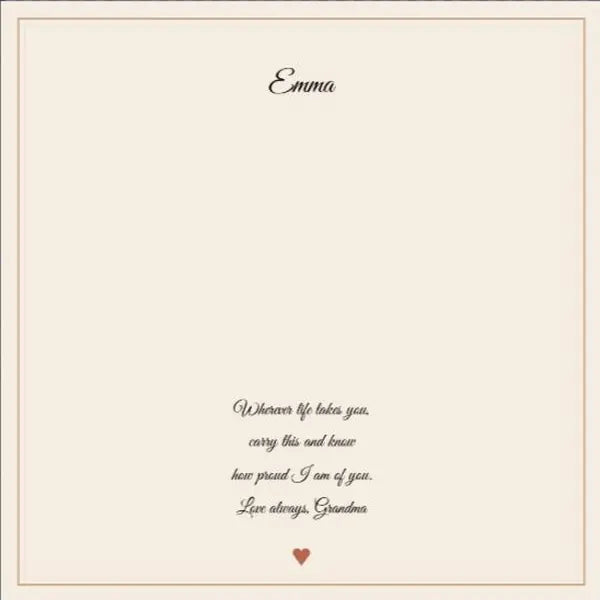 The printed card up close: a name on the top line, four short lines of message and sign-off below the necklace