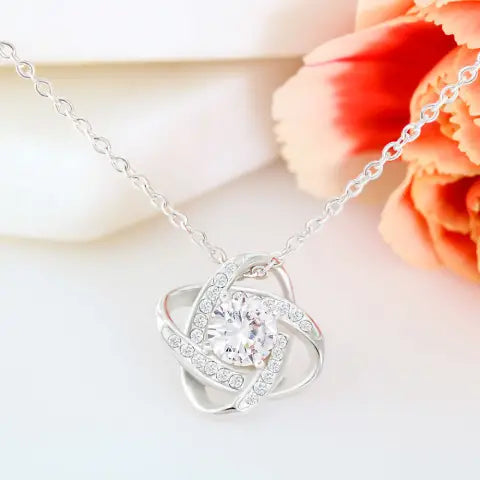 Close-up of the love knot pendant